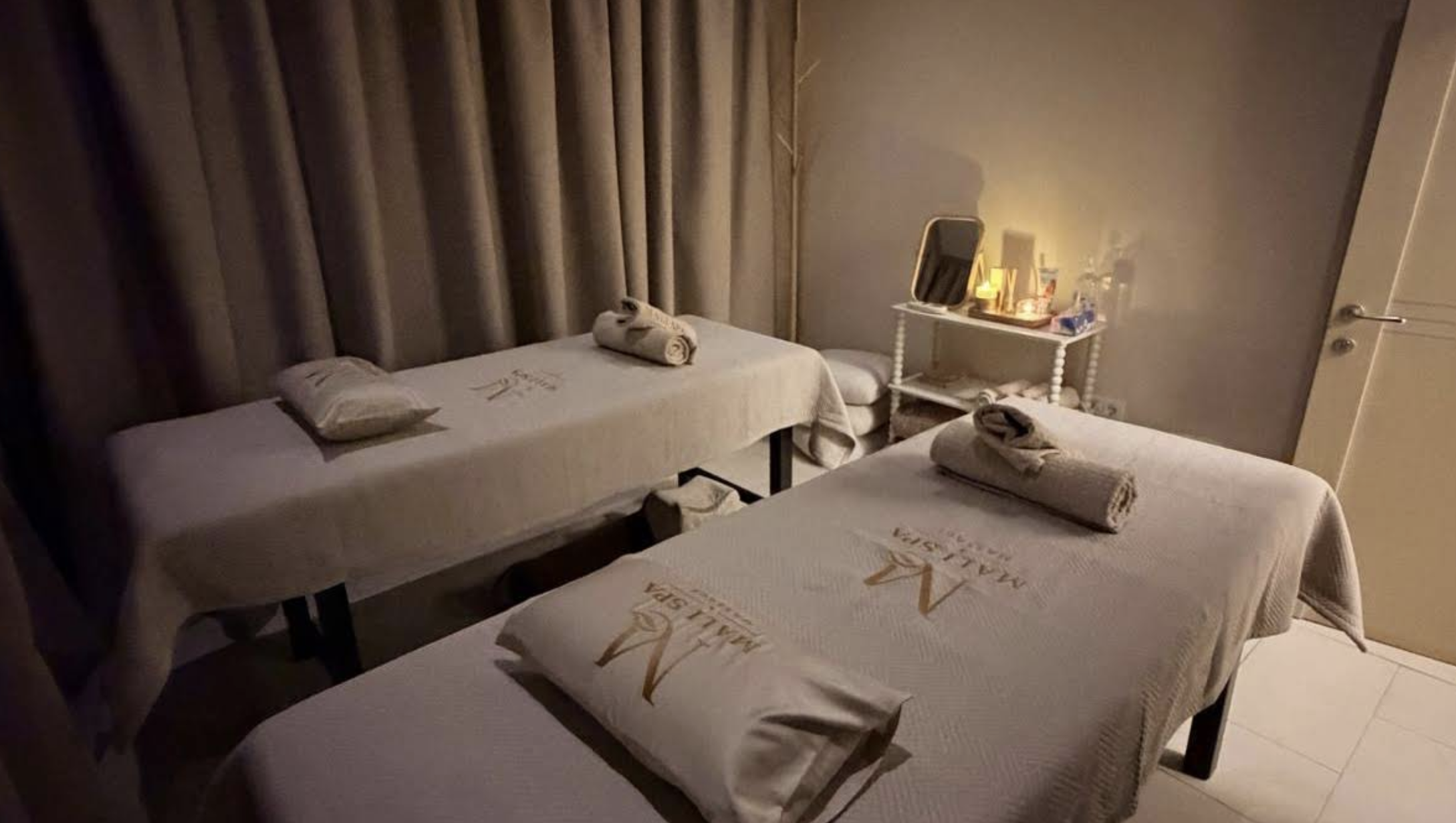 The softly lit massage room at Mali Spa